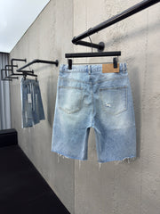 Ripped sticker denim shorts
