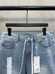 Ripped sticker denim shorts