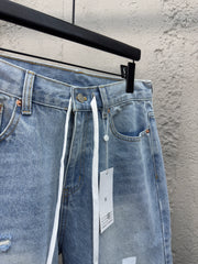 Ripped sticker denim shorts