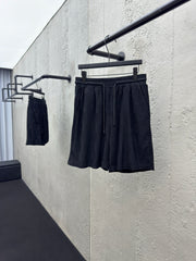 Checkerboard embroidered woolen shorts