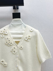 V-neck sweater with 3D floral embellishments