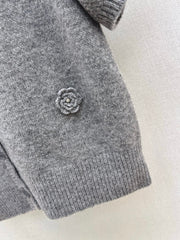 V-neck sweater with 3D floral embellishments