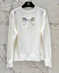 Bowknot hollow jacquard crew neck knitted sweater
