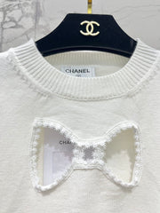Bowknot hollow jacquard crew neck knitted sweater