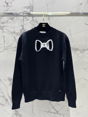 Bowknot hollow jacquard crew neck knitted sweater