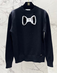 Bowknot hollow jacquard crew neck knitted sweater