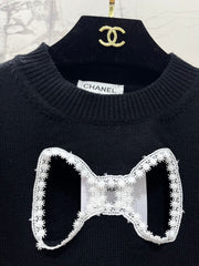 Bowknot hollow jacquard crew neck knitted sweater