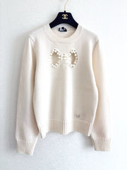 Openwork bow sweater