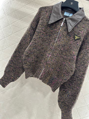 Leather-trimmed lapel knit zip-up jacket.