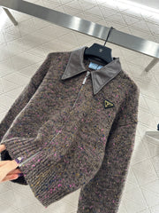 Leather-trimmed lapel knit zip-up jacket.