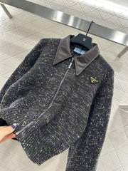 Leather-trimmed lapel knit zip-up jacket.