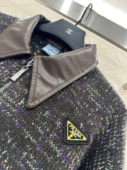 Leather-trimmed lapel knit zip-up jacket.