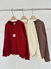 Oversized sweater with diamond cable knit pattern