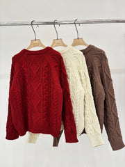 Oversized sweater with diamond cable knit pattern