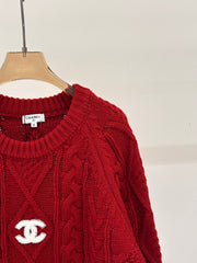 Oversized sweater with diamond cable knit pattern