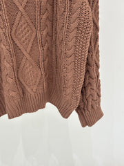 Oversized sweater with diamond cable knit pattern