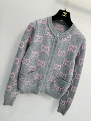 Pink and gray color-blocked crew neck cardigan