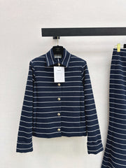 A navy blue coat with beige pinstripes and a lapel collar