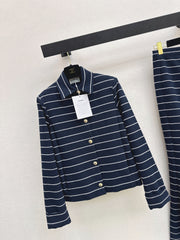 A navy blue coat with beige pinstripes and a lapel collar