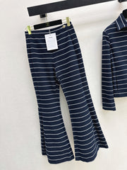 Navy blue flared trousers with beige pinstripes