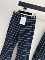 Navy blue flared trousers with beige pinstripes
