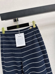 Navy blue flared trousers with beige pinstripes
