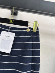 Navy blue flared trousers with beige pinstripes