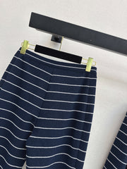 Navy blue flared trousers with beige pinstripes
