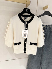 Bow-tie openwork cashmere cardigan with short sleeves