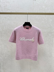 Color-blocked lettered crew neck knit short-sleeved top
