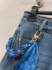Jeans with a silk scarf chain embellishment