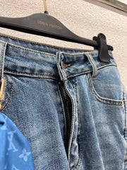 Jeans with a silk scarf chain embellishment