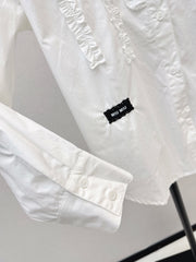 Round neck, ruffled trim, long-sleeved shirt