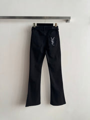 High-waisted embroidered flared pants.