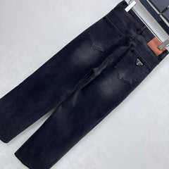 Pleated and distressed denim trousers