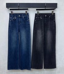 Pleated and distressed denim trousers