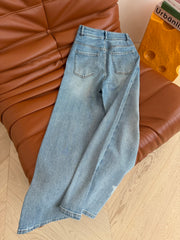 Heavy-duty rhinestone-embellished light blue jeans