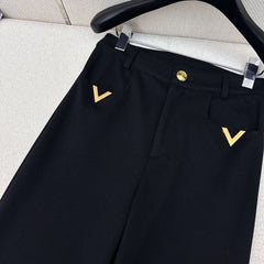 Straight-leg trousers with metal embellishments