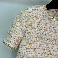 A light beige tweed blend short-sleeved jacket
