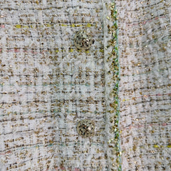 A light beige tweed blend short-sleeved jacket