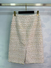 A light beige tweed blend short-sleeved jacket