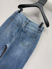 Embroidered logo patch jeans