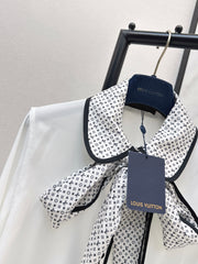 Minimalist white shirt with a long pointed collar