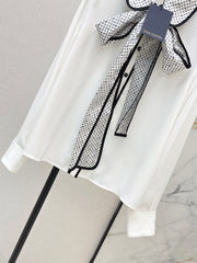 Minimalist white shirt with a long pointed collar
