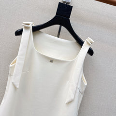Sleeveless dress with bow-tie shoulder straps