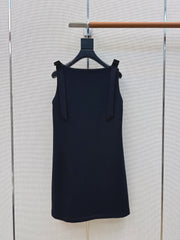 Sleeveless dress with bow-tie shoulder straps
