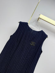 Beige vest dress with contrasting leather label