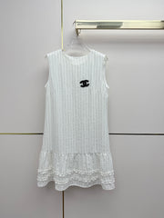 Beige vest dress with contrasting leather label