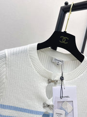 Striped knit top with bow embellishment