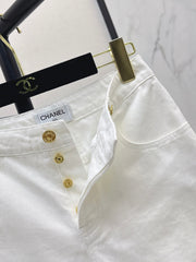 Slim-fit denim trousers with gold buttons